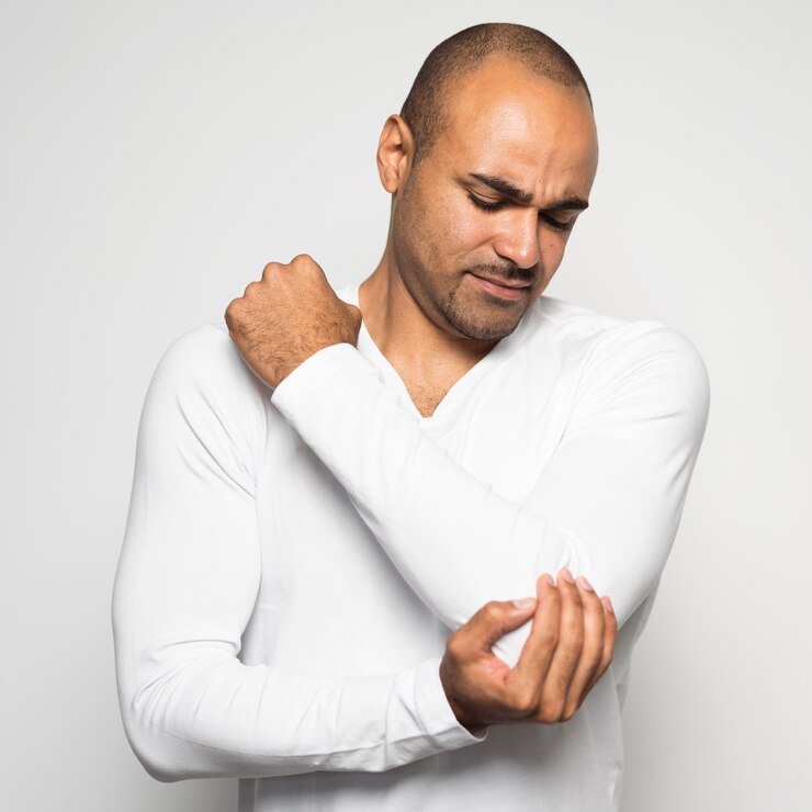 Man having elbow pain - Pain relief - Acupuncture
